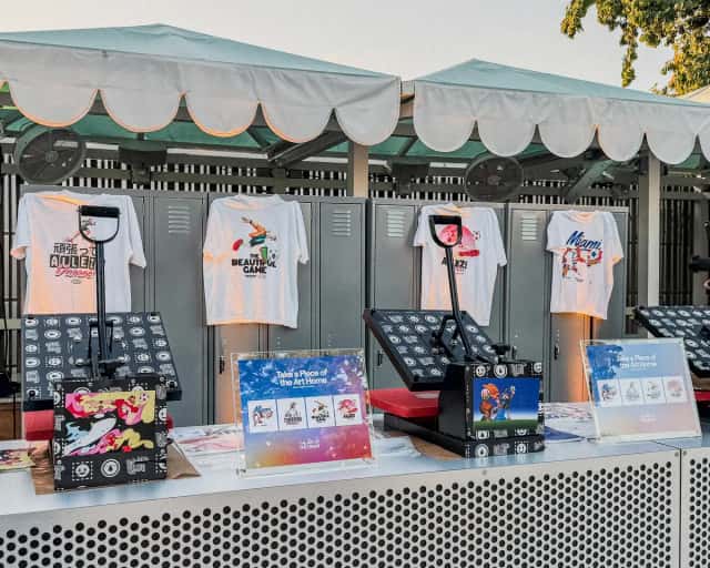 On-site heat press station with printed tees on display